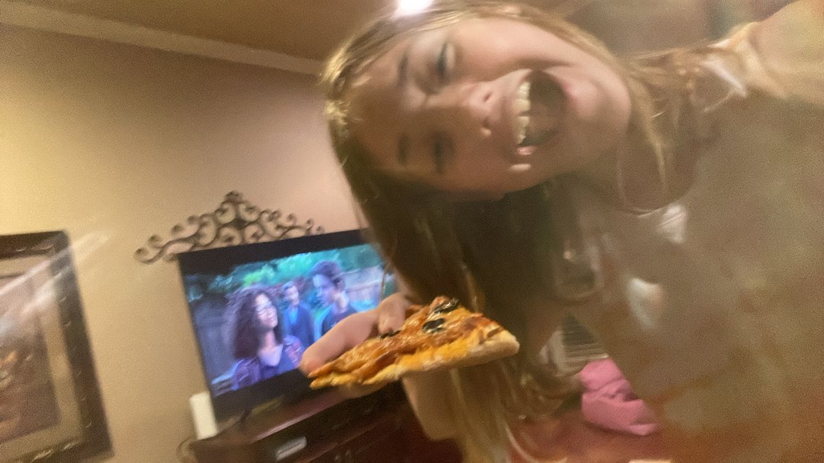 Eating pizza while watching a movie